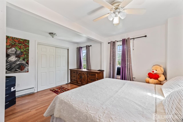 203 Lincoln Blvd, Middlesex, NJ 08846 - bedroom featuring baseboard heating, wood finished floors, ceiling fan, and a closet
