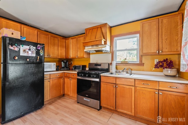 203 Lincoln Blvd, Middlesex, NJ 08846 - kitchen with freestanding refrigerator, stainless steel range with gas stovetop, white microwave, and light countertops