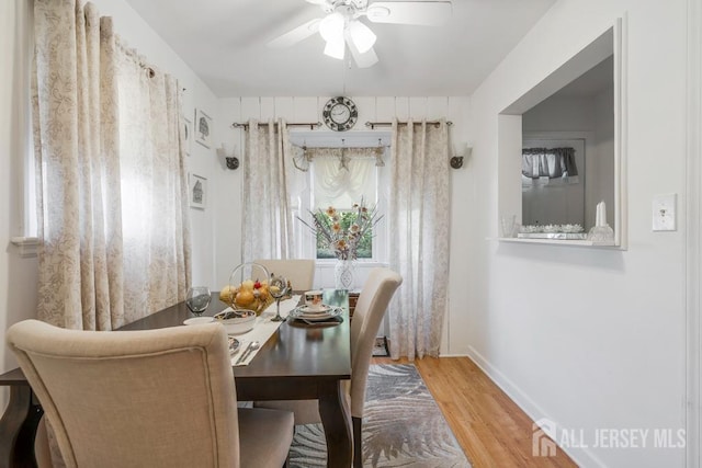 dining space featuring hardwood / wood-style floors and ceiling fan