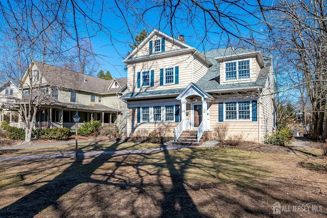 view of front of property featuring a chimney