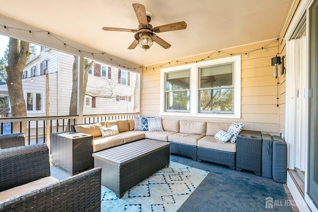 view of patio with an outdoor living space and ceiling fan