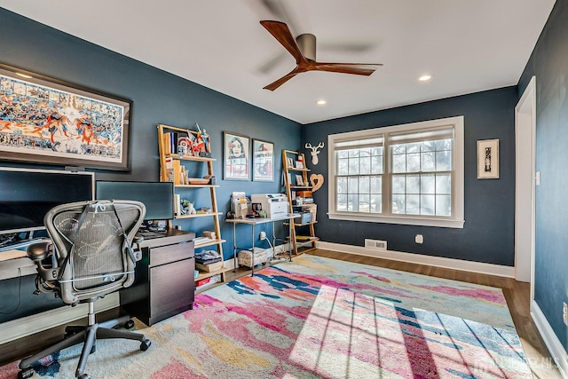 office featuring wood finished floors, baseboards, visible vents, ceiling fan, and recessed lighting