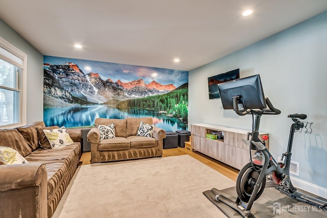 workout room featuring light wood-style flooring, recessed lighting, and baseboards