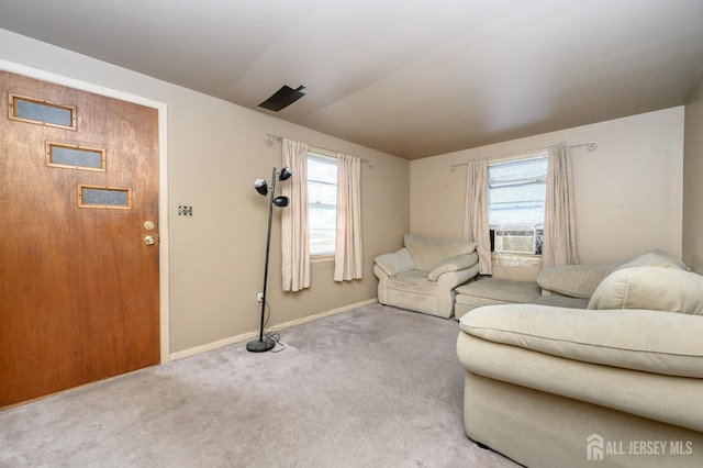 living room featuring baseboards and carpet