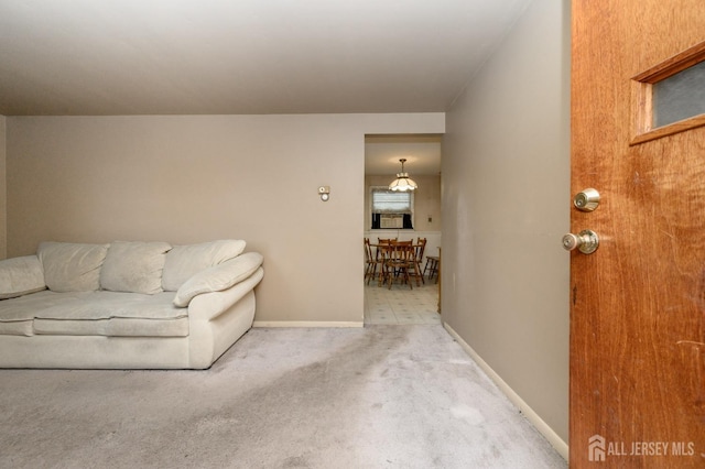 living area with carpet and baseboards