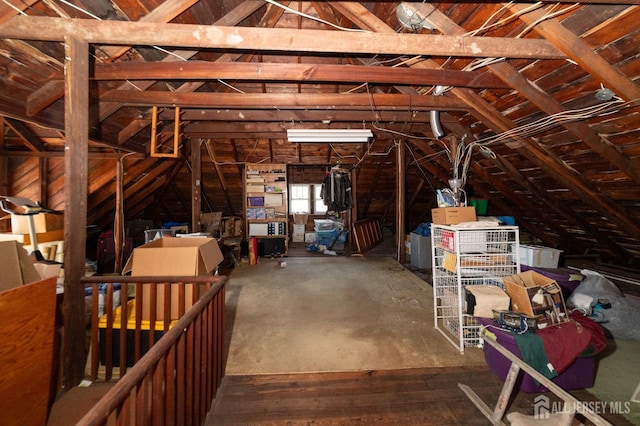 attic featuring an upstairs landing