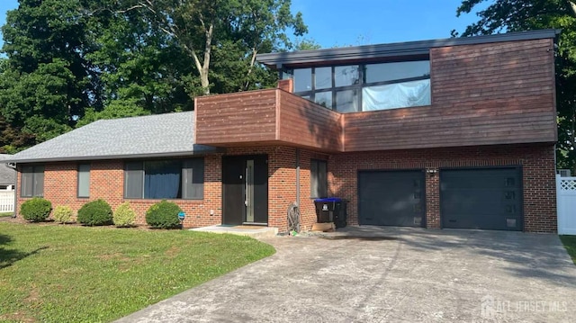 modern home featuring a garage and a front lawn