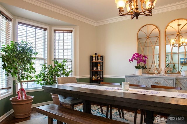 23 Keswick Cir, Monroe, NJ 08831 - dining area with a chandelier, crown molding, wood finished floors, and baseboards