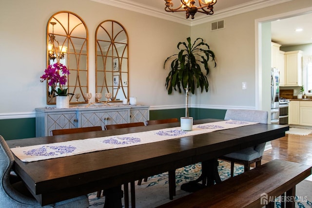 23 Keswick Cir, Monroe, NJ 08831 - dining space with a chandelier, crown molding, and light wood finished floors