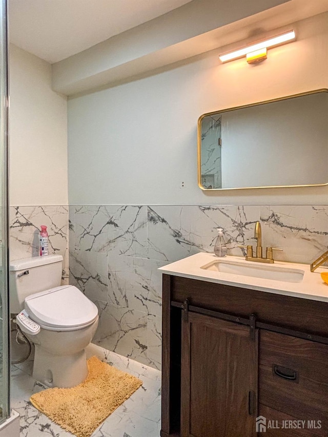 23 Keswick Cir, Monroe, NJ 08831 - bathroom featuring vanity, marble finish flooring, toilet, tile walls, and a wainscoted wall
