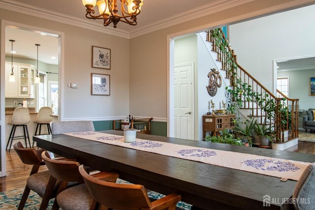 23 Keswick Cir, Monroe, NJ 08831 - dining area with wood finished floors, stairway, a chandelier, and ornamental molding