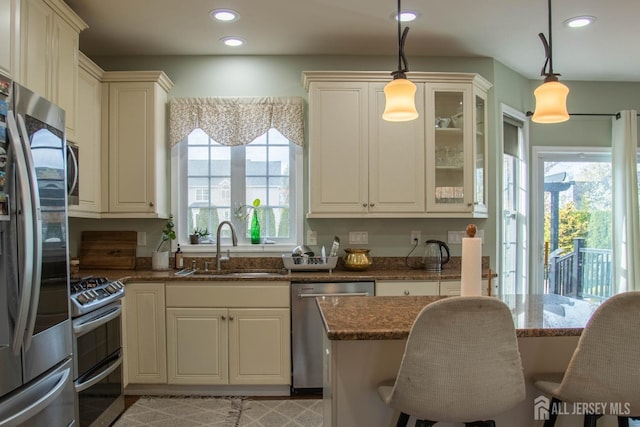 23 Keswick Cir, Monroe, NJ 08831 - kitchen featuring appliances with stainless steel finishes, a sink, healthy amount of natural light, dark stone countertops, and recessed lighting