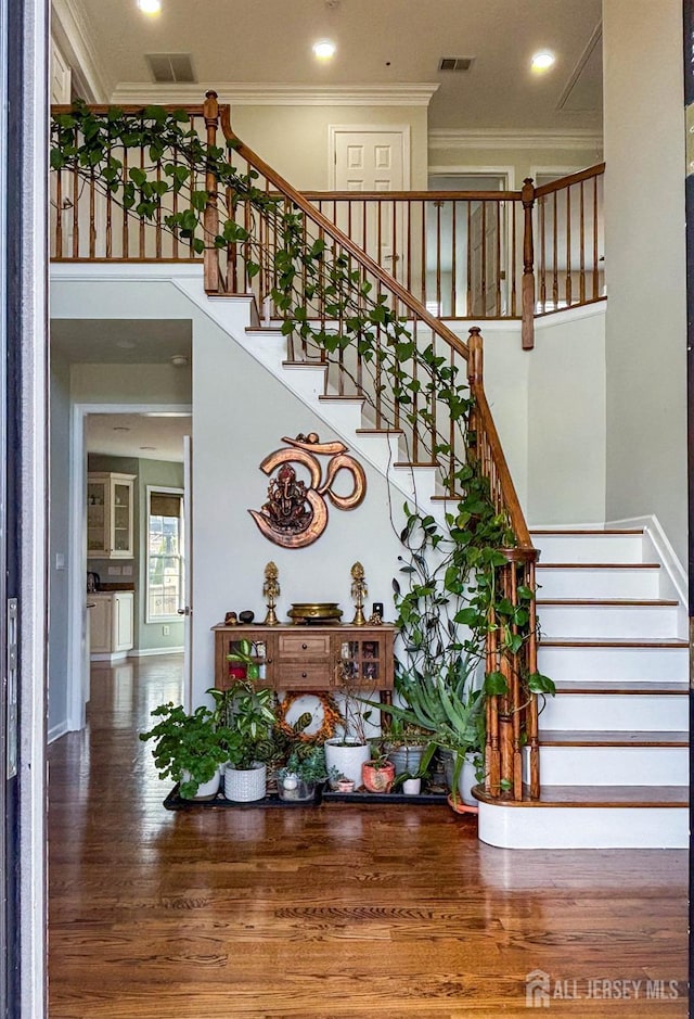 23 Keswick Cir, Monroe, NJ 08831 - stairs featuring ornamental molding, wood finished floors, recessed lighting, and a towering ceiling