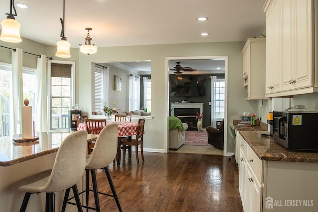 23 Keswick Cir, Monroe, NJ 08831 - kitchen with ceiling fan, healthy amount of natural light, recessed lighting, a kitchen breakfast bar, and dark stone countertops