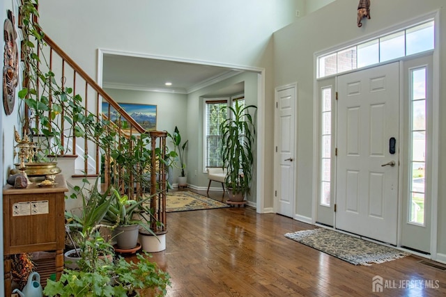 23 Keswick Cir, Monroe, NJ 08831 - foyer featuring crown molding, stairs, wood finished floors, and baseboards