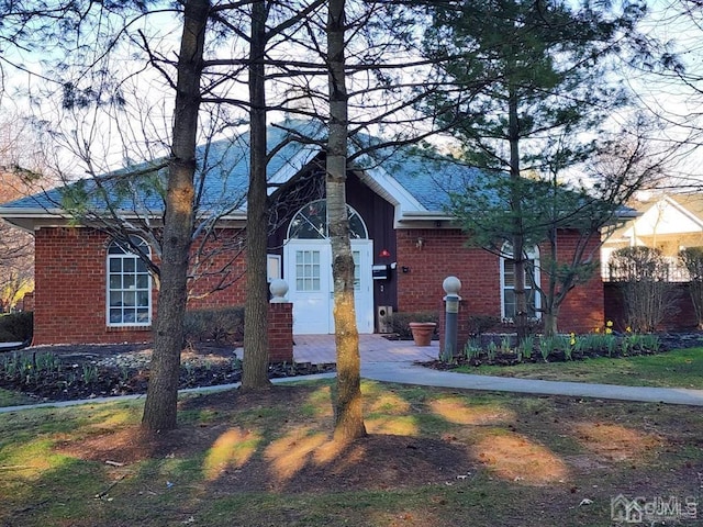 view of front of house with brick siding