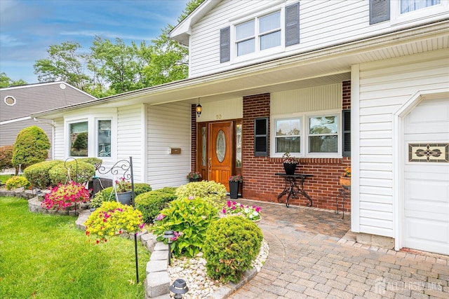 10 Rainbow Dr, Colonia, NJ 07067 - view of exterior entry featuring a porch and brick siding