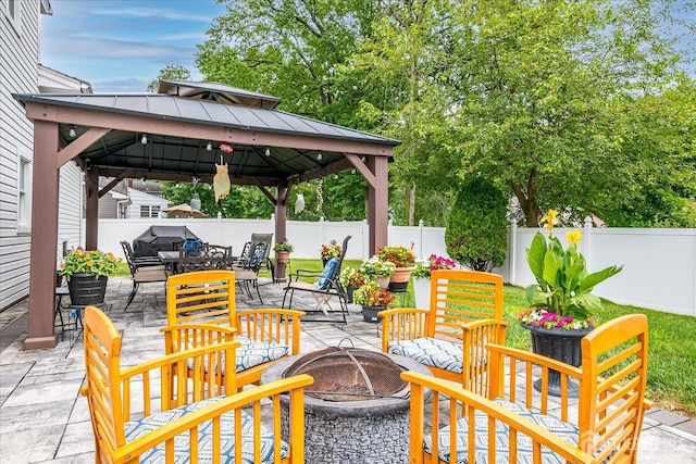 10 Rainbow Dr, Colonia, NJ 07067 - fenced backyard with a fire pit, a gazebo, a patio, and outdoor dining area