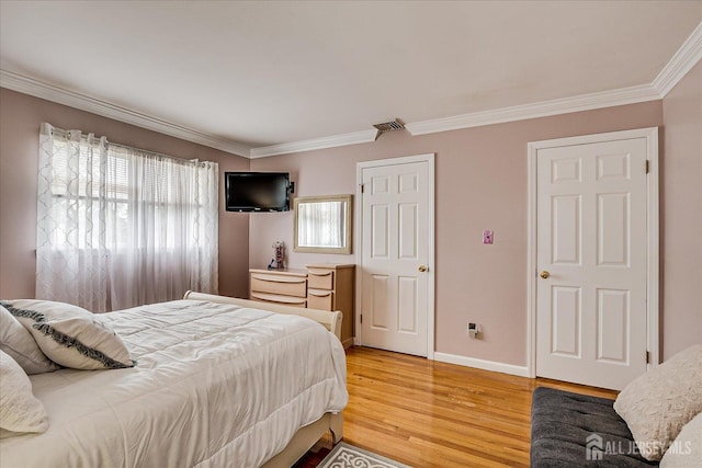 10 Rainbow Dr, Colonia, NJ 07067 - bedroom featuring ornamental molding and light wood-style flooring