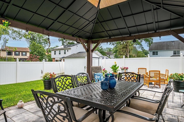 10 Rainbow Dr, Colonia, NJ 07067 - fenced backyard with outdoor dining area, a shed, a gazebo, and a residential view