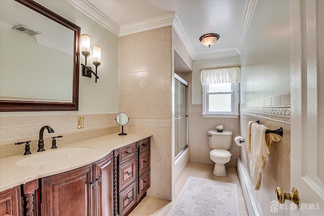 10 Rainbow Dr, Colonia, NJ 07067 - full bathroom featuring tile walls, tile patterned floors, vanity, ornamental molding, and enclosed tub / shower combo