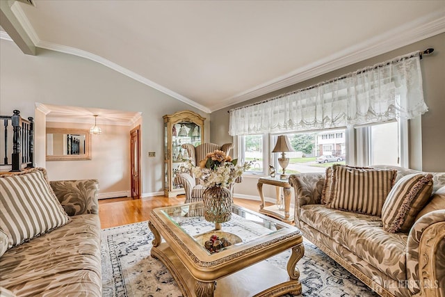 10 Rainbow Dr, Colonia, NJ 07067 - living room with light wood-style flooring, vaulted ceiling, crown molding, and a baseboard heating unit