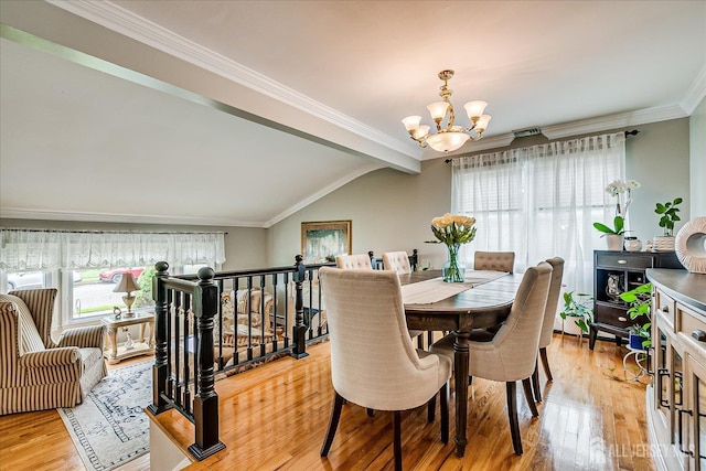 10 Rainbow Dr, Colonia, NJ 07067 - dining room with a chandelier, light wood-style floors, crown molding, and vaulted ceiling