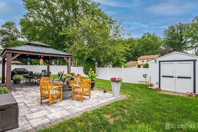 10 Rainbow Dr, Colonia, NJ 07067 - fenced backyard featuring a patio, a storage unit, a gazebo, and an outdoor living space
