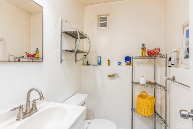 bathroom featuring sink and toilet