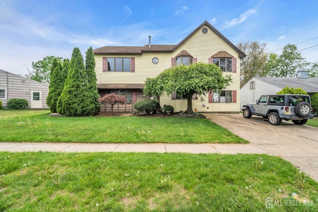 view of front of property with a front lawn