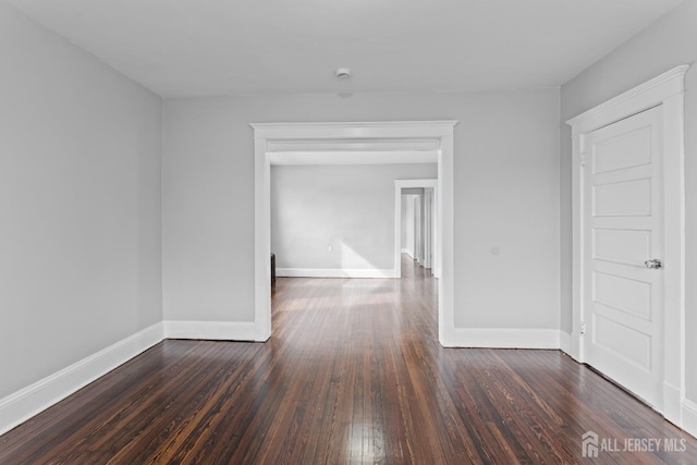 89 Woodbridge Ave, Highland Park, NJ 08904 - empty room with dark wood-style flooring and baseboards