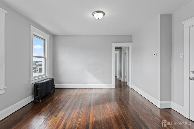 89 Woodbridge Ave, Highland Park, NJ 08904 - spare room with baseboards, radiator, and hardwood / wood-style floors
