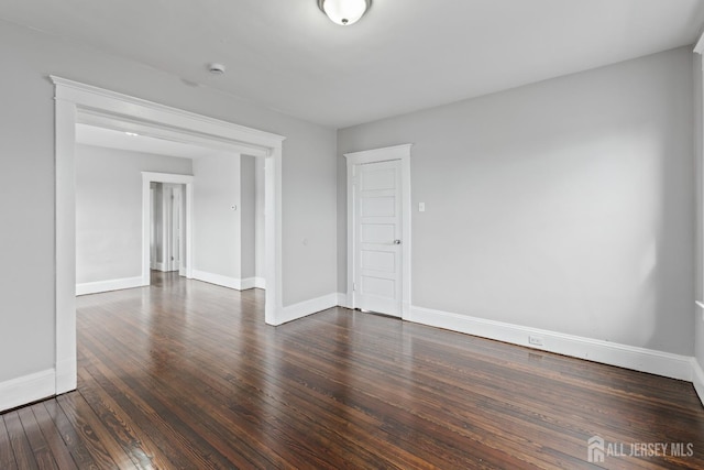 89 Woodbridge Ave, Highland Park, NJ 08904 - spare room featuring dark wood-style flooring and baseboards