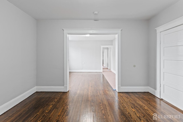 89 Woodbridge Ave, Highland Park, NJ 08904 - empty room featuring baseboards and dark wood-type flooring