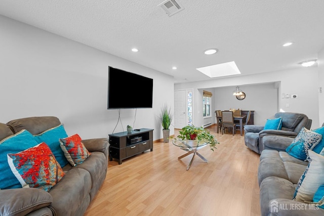 375-C Duranta Plz, Monroe, NJ 08831 - living area with a skylight, recessed lighting, light wood-type flooring, a textured ceiling, and a chandelier