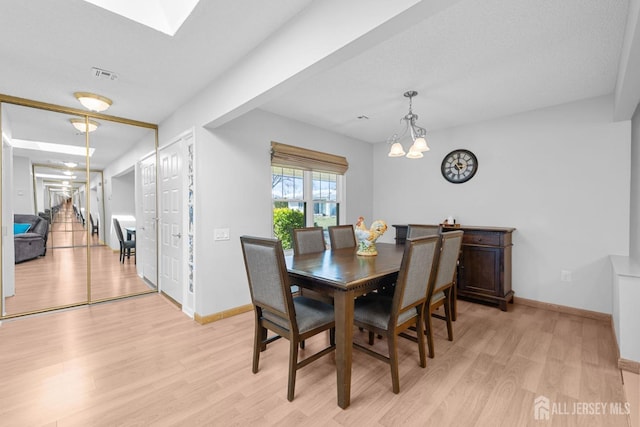 375-C Duranta Plz, Monroe, NJ 08831 - dining room featuring light wood-type flooring, a chandelier, and baseboards
