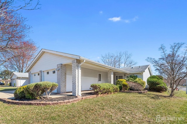 375-C Duranta Plz, Monroe, NJ 08831 - view of home's exterior with a yard, an attached garage, and concrete driveway