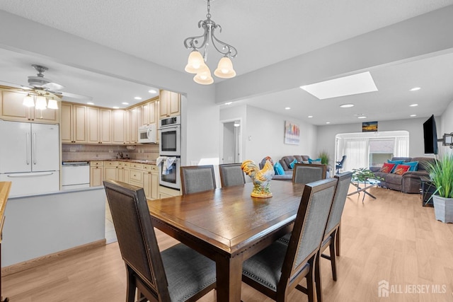 375-C Duranta Plz, Monroe, NJ 08831 - dining area featuring light wood-type flooring, a skylight, a chandelier, and recessed lighting