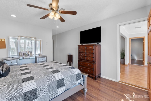 375-C Duranta Plz, Monroe, NJ 08831 - bedroom featuring wood finished floors, a textured ceiling, ceiling fan, recessed lighting, and baseboards