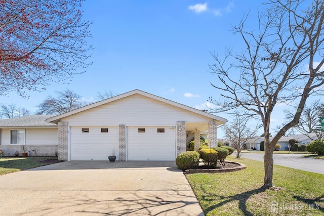 375-C Duranta Plz, Monroe, NJ 08831 - view of front facade with brick siding, driveway, a front lawn, and a garage