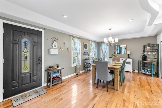 11 Stockton Rd, New Brunswick, NJ 08901 - dining room with a chandelier, a raised ceiling, light wood finished floors, and recessed lighting