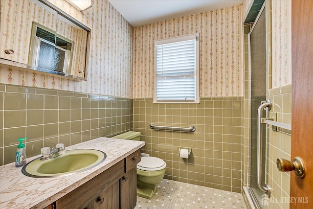 31 Riverview Ter, Hillsborough, NJ 08844 - full bathroom featuring wallpapered walls, a shower with shower door, vanity, tile walls, and wainscoting