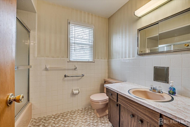 31 Riverview Ter, Hillsborough, NJ 08844 - full bath featuring vanity, tile walls, bath / shower combo with glass door, and wainscoting