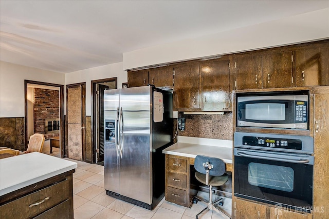 31 Riverview Ter, Hillsborough, NJ 08844 - kitchen with appliances with stainless steel finishes, light countertops, a desk, light tile patterned floors, and dark brown cabinetry