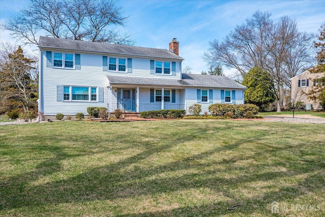 31 Riverview Ter, Hillsborough, NJ 08844 - view of front of home featuring a chimney, covered porch, and a front lawn