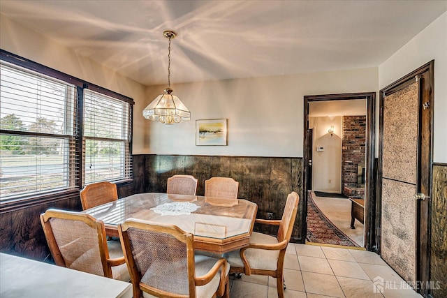 31 Riverview Ter, Hillsborough, NJ 08844 - dining area with a chandelier, wainscoting, and light tile patterned floors