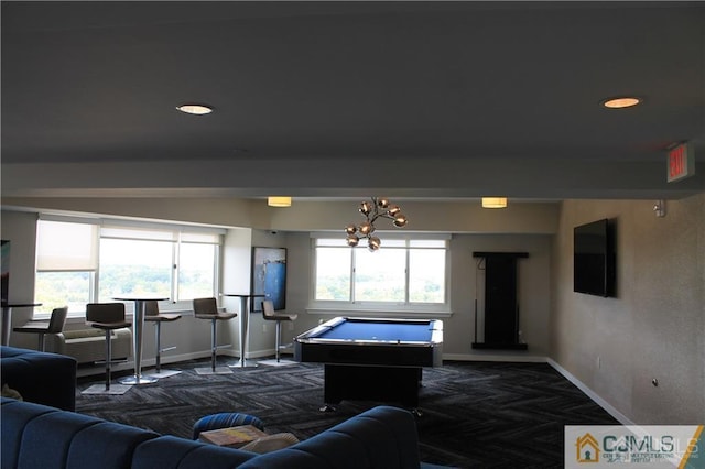 rec room featuring a chandelier, a wealth of natural light, and pool table