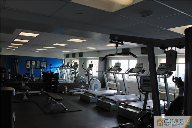 exercise room with a drop ceiling