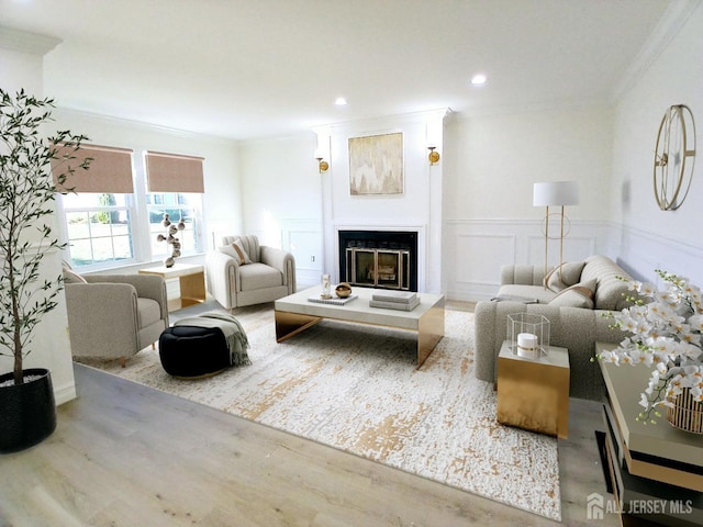 living room with wood-type flooring and crown molding