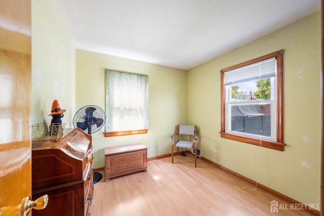 86 Lawrence St, Fords, NJ 08863 - sitting room with light wood-type flooring and baseboards